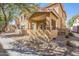 Inviting exterior view of a residential building with covered patios, desert landscaping, and tiled roofs at 525 N Miller Rd # 122, Scottsdale, AZ 85257