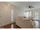 Bright living room featuring hardwood floors, a ceiling fan and neutral paint at 525 N Miller Rd # 122, Scottsdale, AZ 85257