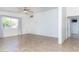 Spacious living room with tile flooring and a large window that lets in a lot of natural light at 5907 N Azalia St, Casa Grande, AZ 85122