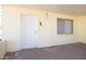 Inviting covered porch with brick flooring, a secure white door and a side window for natural light at 5907 N Azalia St, Casa Grande, AZ 85122