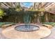 Beautiful landscaped courtyard with verdant vines, modern benches and artistic fountain feature at 7161 E Rancho Vista Dr # 2015, Scottsdale, AZ 85251