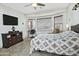 This bedroom features a bay window, ceiling fan, and tiled floor for added comfort at 8176 S Pioneer Ct, Gold Canyon, AZ 85118