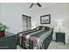 The bedroom features a ceiling fan and a window for natural light at 8176 S Pioneer Ct, Gold Canyon, AZ 85118