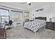 Bright bedroom with bay window, desk, and tile flooring offers a comfortable retreat at 8176 S Pioneer Ct, Gold Canyon, AZ 85118