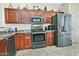 Stylish kitchen featuring granite countertops, stainless steel appliances, and wood cabinetry at 8176 S Pioneer Ct, Gold Canyon, AZ 85118