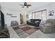 Open concept living room features comfortable furniture, tile floors and a ceiling fan at 8176 S Pioneer Ct, Gold Canyon, AZ 85118