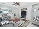 Spacious living room with tile floors, ceiling fan, and seamless access to other living areas at 8176 S Pioneer Ct, Gold Canyon, AZ 85118