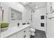 Bright bathroom featuring a vanity with black hardware, decorative mirror and a stylish walk-in shower at 8653 E Royal Palm Rd # 1033, Scottsdale, AZ 85258