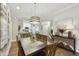 Elegant dining room showcases a stylish light fixture and seamless access to the kitchen at 8653 E Royal Palm Rd # 1033, Scottsdale, AZ 85258