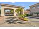 Inviting community entrance with palm trees and manicured landscaping for a welcoming ambiance at 8653 E Royal Palm Rd # 1033, Scottsdale, AZ 85258