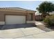 A well-maintained home with a two-car garage and desert landscaping at 901 W Oriole Way, Chandler, AZ 85286