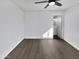 Bedroom featuring wood-look floors and view to a bathroom at 909 W Danbury Rd, Phoenix, AZ 85023