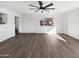 Bright open living room with wood floors, large window, and neutral decor at 909 W Danbury Rd, Phoenix, AZ 85023