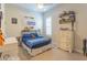 Charming bedroom featuring baseball decor, shelving, and a cozy bed, perfect for a young sports enthusiast at 9266 E Desert Village Dr, Scottsdale, AZ 85255