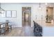 Hallway view of dining area, kitchen and front entry at 9266 E Desert Village Dr, Scottsdale, AZ 85255