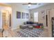 Spacious living room with a large sectional sofa, patterned rug, and ample natural light at 9266 E Desert Village Dr, Scottsdale, AZ 85255