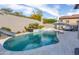 Gorgeous pool with a slide, spa, and well-maintained surrounding patio, perfect for recreation and relaxation at 9266 E Desert Village Dr, Scottsdale, AZ 85255