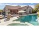 Stunning backyard pool area showcasing a spa, waterfall feature, and comfortable lounge chairs at 9266 E Desert Village Dr, Scottsdale, AZ 85255