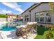 Inviting poolside retreat featuring comfortable lounge chairs, a well-maintained pool, and lush landscaping at 9266 E Desert Village Dr, Scottsdale, AZ 85255