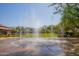 A community splash pad featuring water fountains provides a refreshing outdoor recreational space at 9266 E Desert Village Dr, Scottsdale, AZ 85255