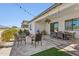 Beautiful back patio with stone flooring, a fire pit, and ample seating for outdoor entertaining at 942 E Paseo Way, Phoenix, AZ 85042