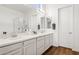 Bathroom featuring hardwood floors, a double vanity and an enclosed glass shower at 942 E Paseo Way, Phoenix, AZ 85042