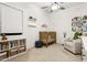 Bright Bedroom with a crib, chair, shelving unit, and book display at 942 E Paseo Way, Phoenix, AZ 85042