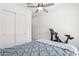 Bright bedroom featuring neutral tones, ceiling fan, and exercise bike at 942 E Paseo Way, Phoenix, AZ 85042