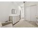 Bright bedroom with a dresser, mirror, and closet at 942 E Paseo Way, Phoenix, AZ 85042