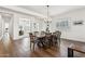 Bright dining room featuring a large table with hardwood floors and an elegant chandelier at 942 E Paseo Way, Phoenix, AZ 85042