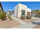 Stunning single story home showcasing a stone facade with low maintenance desert landscaping at 942 E Paseo Way, Phoenix, AZ 85042