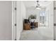 Office with neutral carpet, plantation shutters, ceiling fan, and a wooden desk at 942 E Paseo Way, Phoenix, AZ 85042