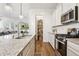 Kitchen with granite countertops, stainless steel appliances, and an adjacent walk-in pantry at 942 E Paseo Way, Phoenix, AZ 85042