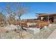 Outdoor seating area with benches and desert landscaping at 942 E Paseo Way, Phoenix, AZ 85042