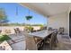 Inviting patio with a dining area, fire pit, and swing, ideal for entertaining at 942 E Paseo Way, Phoenix, AZ 85042