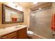 Bathroom featuring a vanity with countertop and a glass-enclosed shower at 9513 W Cottonwood Dr, Sun City, AZ 85373