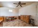 Bonus room with neutral paint, tile floors, ceiling fan, and a small window at 9513 W Cottonwood Dr, Sun City, AZ 85373