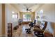 Bonus room featuring tile flooring, ceiling fan, small window, and comfortable seating at 9513 W Cottonwood Dr, Sun City, AZ 85373