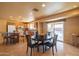 Open floor plan with dining area, kitchen and chairs at the counter at 9513 W Cottonwood Dr, Sun City, AZ 85373