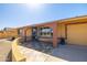 Welcoming front entrance with tiled patio and covered entryway, leading to the front door at 9513 W Cottonwood Dr, Sun City, AZ 85373