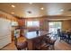 Functional kitchen featuring a center island, tile flooring, and essential appliances at 9513 W Cottonwood Dr, Sun City, AZ 85373