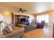 Bright and airy living room with neutral tones, tile floors, and natural light from window at 9513 W Cottonwood Dr, Sun City, AZ 85373