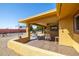 Covered patio featuring tile flooring and comfortable seating, perfect for outdoor entertaining at 9513 W Cottonwood Dr, Sun City, AZ 85373