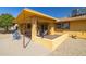 View of the outdoor patio with tile floor and seating, offering a relaxing outdoor space at 9513 W Cottonwood Dr, Sun City, AZ 85373