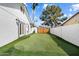Backyard featuring a putting green and white brick wall and fence at 10052 N 77Th St, Scottsdale, AZ 85258