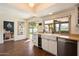 This kitchen has stainless steel appliances, white cabinetry, and a view of the backyard at 10052 N 77Th St, Scottsdale, AZ 85258