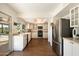 Bright kitchen featuring white cabinetry, stainless steel appliances, and a view of the pool at 10052 N 77Th St, Scottsdale, AZ 85258