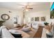 Inviting living room featuring arched doorways, stylish decor, hardwood floors, and comfortable seating at 10052 N 77Th St, Scottsdale, AZ 85258