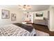 The main bedroom features an ensuite bath, ceiling fan, and a walk-in closet at 10052 N 77Th St, Scottsdale, AZ 85258
