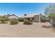Spacious backyard with desert landscaping and mature trees at 1016 E Utopia Rd, Phoenix, AZ 85024